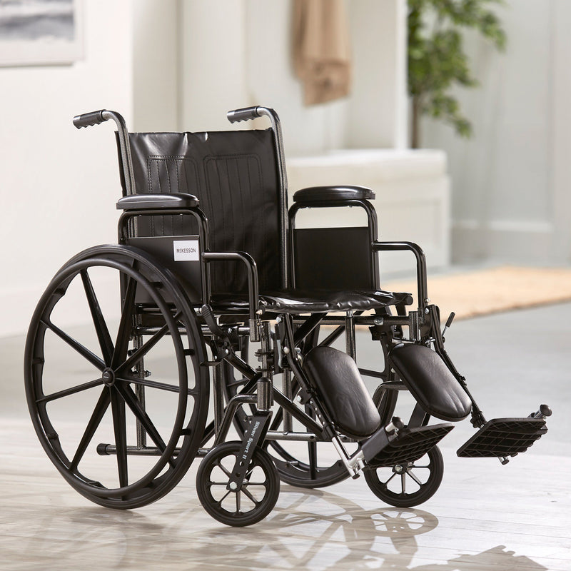 McKesson Dual Axle Wheelchair with Desk Length Arm Swing-Away Elevating Legrest, 20 Inch Seat Width -Each McKesson Dual Axle Wheelchair with Desk Length Arm Swing-Away Elevating Legrest, 20 Inch Seat Width -Each